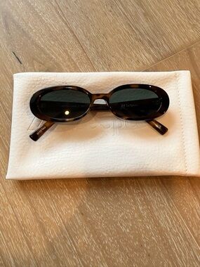 Le Specs Oval Sunglasses in Dark Tortoiseshell and Black Lenses